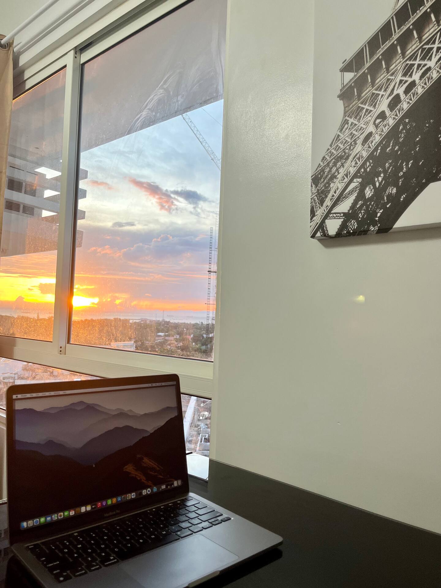 Workspace by the window with a sunset view