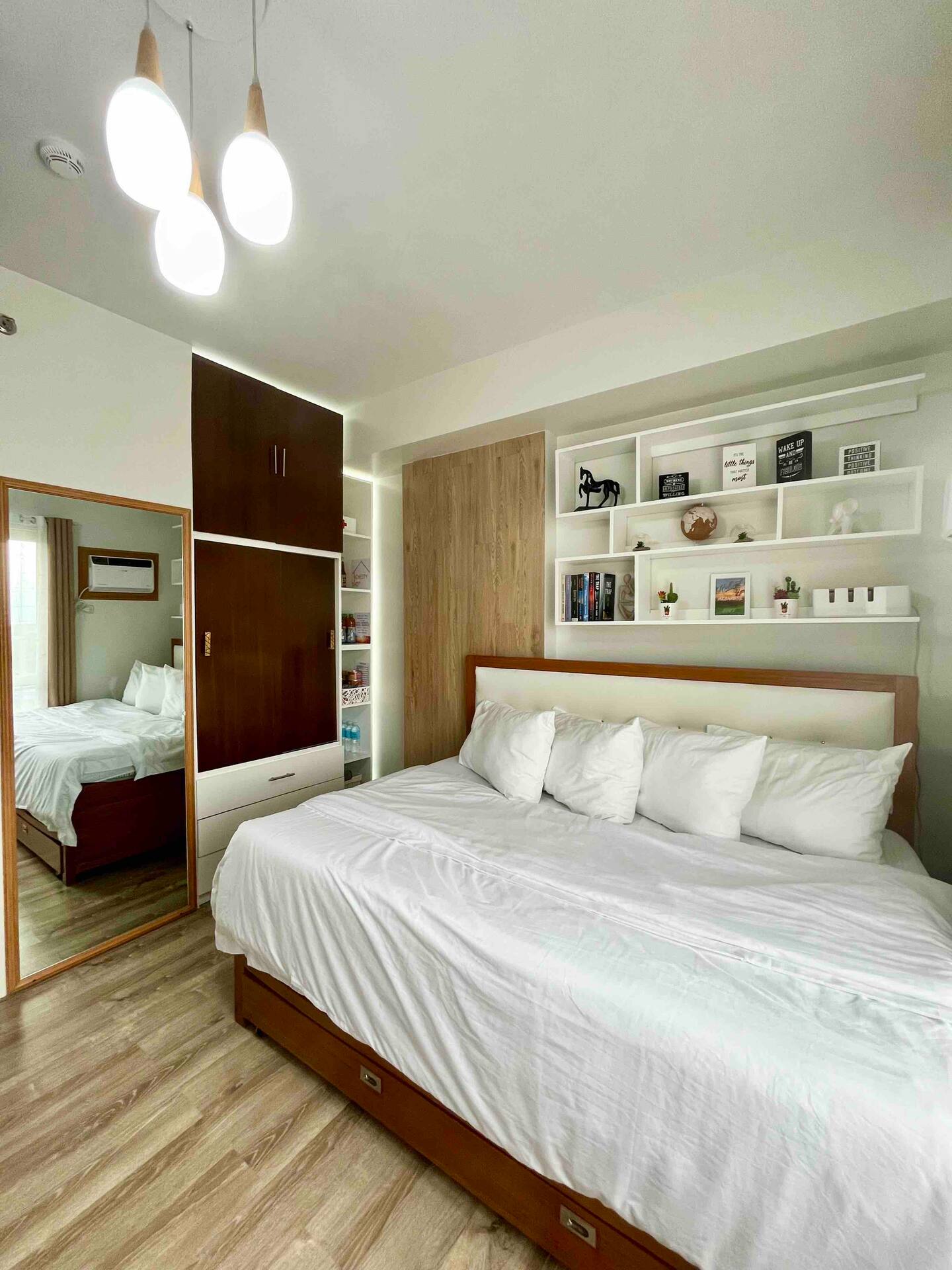 Cozy bed with styled shelving